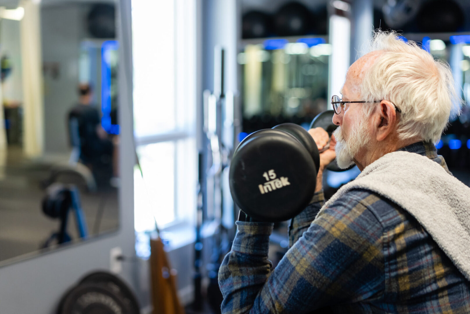 A man holding a weight in his hands.